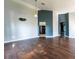 Spacious living room with dark hardwood floors, high ceilings and neutral paint at 8004 Juniper Rd, Ocala, FL 34480