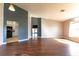 Spacious living room with dark hardwood floors, high ceilings and neutral paint at 8004 Juniper Rd, Ocala, FL 34480