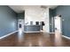 Spacious living room featuring hardwood floors with an open concept kitchen at 8004 Juniper Rd, Ocala, FL 34480