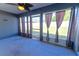 Screened patio with grey walls, tile flooring, and backyard views at 8004 Juniper Rd, Ocala, FL 34480