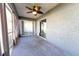 Screened patio featuring neutral walls, tile flooring, and backyard access at 8004 Juniper Rd, Ocala, FL 34480