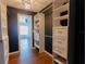 Custom walk-in closet offers ample storage with built-in shelving and drawer units at 8004 Juniper Rd, Ocala, FL 34480