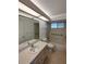 Bright bathroom with tub-shower combo and grab bars for accessibility at 8045 Sw 108Th Loop, Ocala, FL 34481