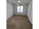 Cozy bedroom featuring a window and closet for convenient storage at 8045 Sw 108Th Loop, Ocala, FL 34481
