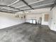 The large garage offers a laundry area, utility sink, storage, and ample parking space at 8045 Sw 108Th Loop, Ocala, FL 34481
