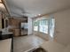 Bright eat-in kitchen featuring stainless steel refrigerator and a bay window at 8045 Sw 108Th Loop, Ocala, FL 34481