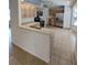 Open kitchen with a breakfast bar, stainless steel appliances, and tile flooring at 8045 Sw 108Th Loop, Ocala, FL 34481
