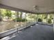 Covered screened porch providing a view of the backyard and landscaping at 8045 Sw 108Th Loop, Ocala, FL 34481