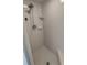 All-tile shower featuring a handheld shower head and a corner bench at 8045 Sw 108Th Loop, Ocala, FL 34481