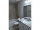 Beautifully updated bathroom with tiled shower, granite countertops, and modern vanity at 8661 Juniper Rd, Ocala, FL 34480