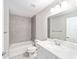 Bright bathroom featuring tiled walls and a sleek, modern vanity at 8661 Juniper Rd, Ocala, FL 34480