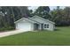 Charming single Gathering home featuring a two car garage, stone accents, and a well manicured lawn at 8661 Juniper Rd, Ocala, FL 34480