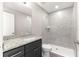 Bathroom featuring a walk-in shower and sleek vanity with granite countertop at 87 Guava Pass Dr, Ocklawaha, FL 32179