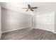 Neutral bedroom with wood floors, large closet, and overhead fan for a cozy atmosphere at 87 Guava Pass Dr, Ocklawaha, FL 32179