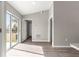 Bright living room featuring wood floors and sliding glass doors to let in natural light at 87 Guava Pass Dr, Ocklawaha, FL 32179
