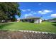 Expansive backyard featuring lush green lawn and mature landscaping, perfect for outdoor entertaining at 8895 Sw 57Th Court Rd, Ocala, FL 34476