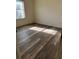 Bedroom with new flooring and natural light from the window at 8895 Sw 57Th Ct Rd, Ocala, FL 34476