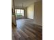 Formal dining room features a chandelier, large window, and new flooring at 8895 Sw 57Th Ct Rd, Ocala, FL 34476