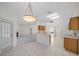 Eat-in kitchen area with breakfast bar and dining space with a chandelier at 8895 Sw 57Th Court Rd, Ocala, FL 34476