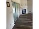 Living room features a fireplace, sliding glass door, and new flooring at 8895 Sw 57Th Ct Rd, Ocala, FL 34476
