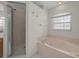 Bright bathroom featuring soaking tub and glass shower at 8895 Sw 57Th Court Rd, Ocala, FL 34476