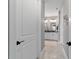 Hallway view into a bathroom featuring dual sinks and modern finishes at 8951 Sw 58Th Street Rd, Ocala, FL 34481