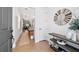 Bright entryway with stylish decor, wood-look tile flooring, and shiplap accent wall at 8951 Sw 58Th Street Rd, Ocala, FL 34481