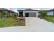 Single-story home with a screened porch, well-kept lawn, and inviting curb appeal at 8951 Sw 58Th Street Rd, Ocala, FL 34481