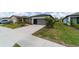 A view of a well-maintained single-story home with a grey garage door at 8951 Sw 58Th Street Rd, Ocala, FL 34481
