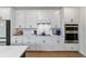 Well-appointed kitchen with white cabinets, stainless steel appliances, and modern design at 8951 Sw 58Th Street Rd, Ocala, FL 34481