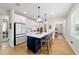 Bright kitchen with island, quartz countertops, and seating for guests at 8951 Sw 58Th Street Rd, Ocala, FL 34481