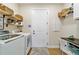 Efficient laundry room with modern washer and dryer, plus storage shelves at 8951 Sw 58Th Street Rd, Ocala, FL 34481