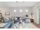 Cozy living room with a comfortable sectional sofa and a bright, airy atmosphere at 8951 Sw 58Th Street Rd, Ocala, FL 34481