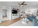 Spacious living room with a comfortable sofa, TV, and an open doorway, leading to another room at 8951 Sw 58Th Street Rd, Ocala, FL 34481