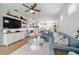 Open-concept living space featuring a comfortable sofa, modern decor, and seamless flow to the kitchen at 8951 Sw 58Th Street Rd, Ocala, FL 34481