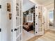 A study featuring a leather couch, built-in bookshelves and double doors at 8951 Sw 58Th Street Rd, Ocala, FL 34481