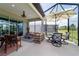 Large screened patio with both dining and seating areas, offering a versatile outdoor living space at 8951 Sw 58Th Street Rd, Ocala, FL 34481