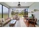 Relaxing screened-in patio featuring a seating area and dining space, ideal for enjoying the outdoors at 8951 Sw 58Th Street Rd, Ocala, FL 34481