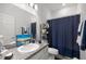 Bathroom with navy accents, granite countertops, and chrome faucet at 9074 Se 48Th Court Rd, Ocala, FL 34480