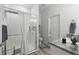 Clean bathroom featuring a glass-enclosed shower and modern fixtures at 9074 Se 48Th Court Rd, Ocala, FL 34480