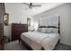 Cozy bedroom with shuttered window and rich dark furniture at 9074 Se 48Th Court Rd, Ocala, FL 34480