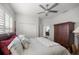 Bedroom with an open door, closet, and a ceiling fan at 9074 Se 48Th Court Rd, Ocala, FL 34480