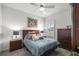 Comfortable bedroom with ceiling fan, area rug, and natural light at 9074 Se 48Th Court Rd, Ocala, FL 34480