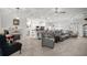 Spacious living room with modern furniture, a fireplace, and an open layout perfect for entertaining at 9074 Se 48Th Court Rd, Ocala, FL 34480