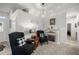 Cozy living room area featuring comfortable seating and a fireplace, creating a warm and inviting atmosphere at 9074 Se 48Th Court Rd, Ocala, FL 34480