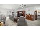 Open concept living room with multiple seating areas and entertainment center at 9074 Se 48Th Court Rd, Ocala, FL 34480