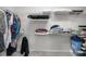 Organized walk-in closet with shelving, rods, and ample storage space at 9074 Se 48Th Court Rd, Ocala, FL 34480