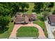 Aerial view of the property showcases the large lot, circular drive, and well-maintained landscaping at 10337 Sw 74Th Ter, Ocala, FL 34476
