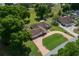 Aerial view of a beautifully landscaped property with a large circular driveway at 10337 Sw 74Th Ter, Ocala, FL 34476