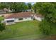 Expansive backyard with a screened in porch and white picket fence, perfect for outdoor living at 10337 Sw 74Th Ter, Ocala, FL 34476